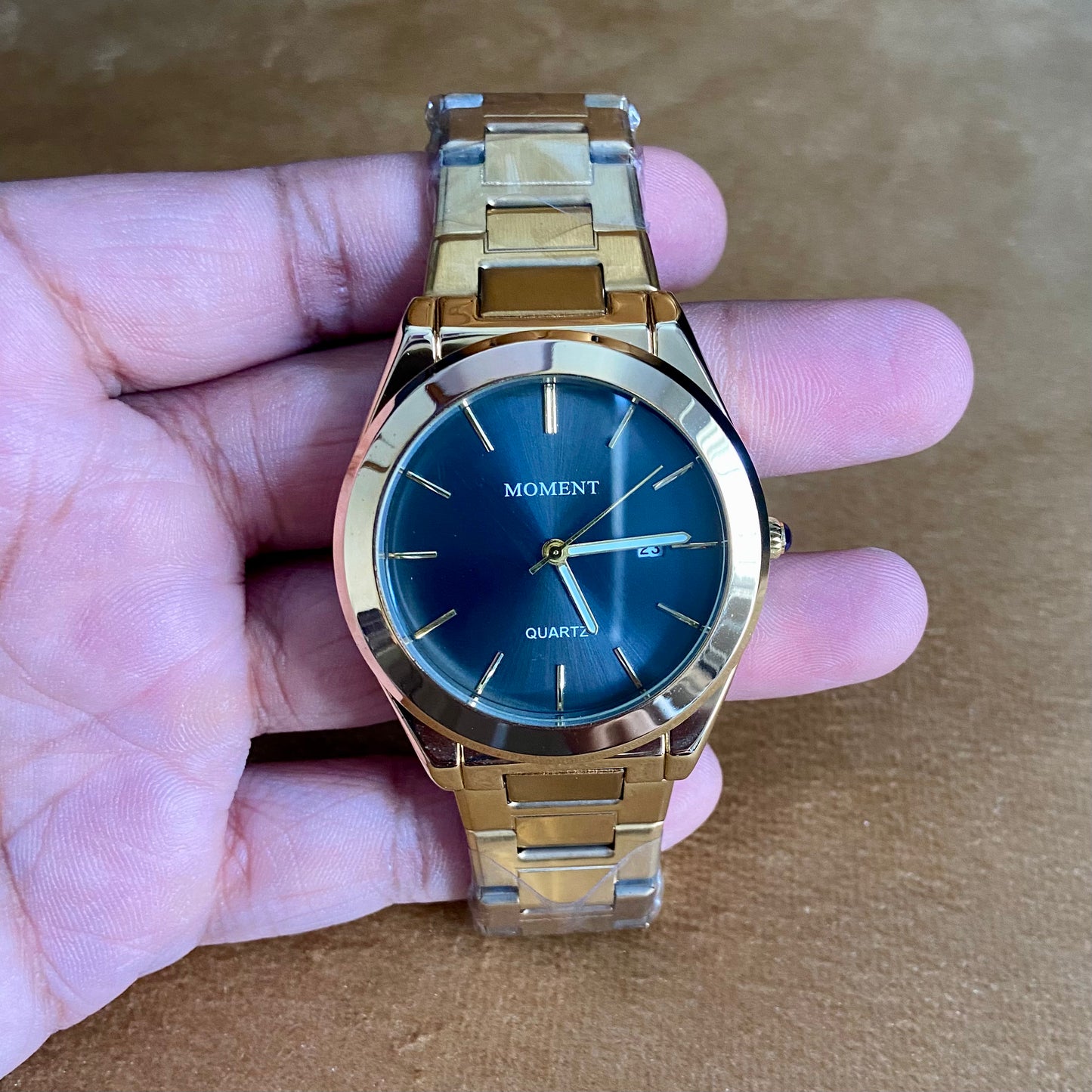 Moment Gold Stainless Steel Quartz Watch – Blue Dial, Date Display